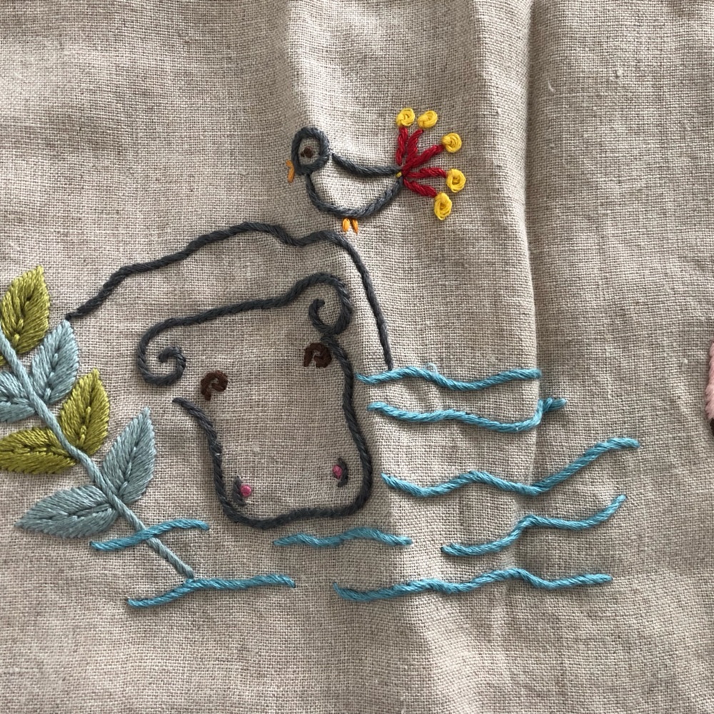 COYUCHI Organic LINEN & flannel baby blanket, with hand stitched animals.